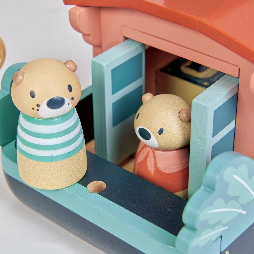 Wooden otter family playing on canal boat, sparks imaginative play with children away from screens 